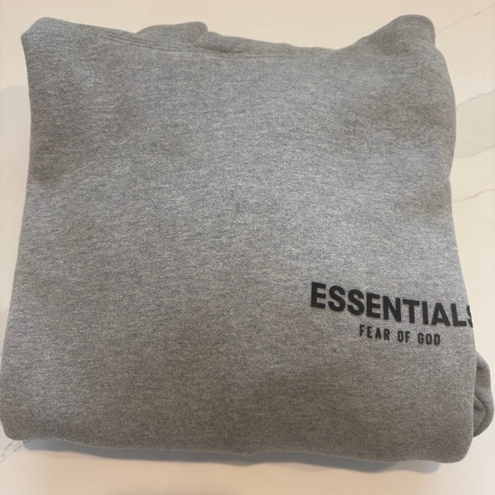 Men’s Fear of God Essentials Heather Gray Pullover XXXS. Originally $120
$40